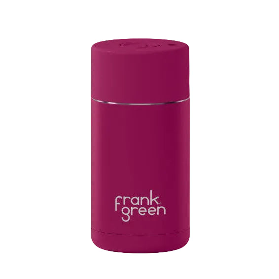 Purple reusable water bottle with 'frank green' branding on a pink background