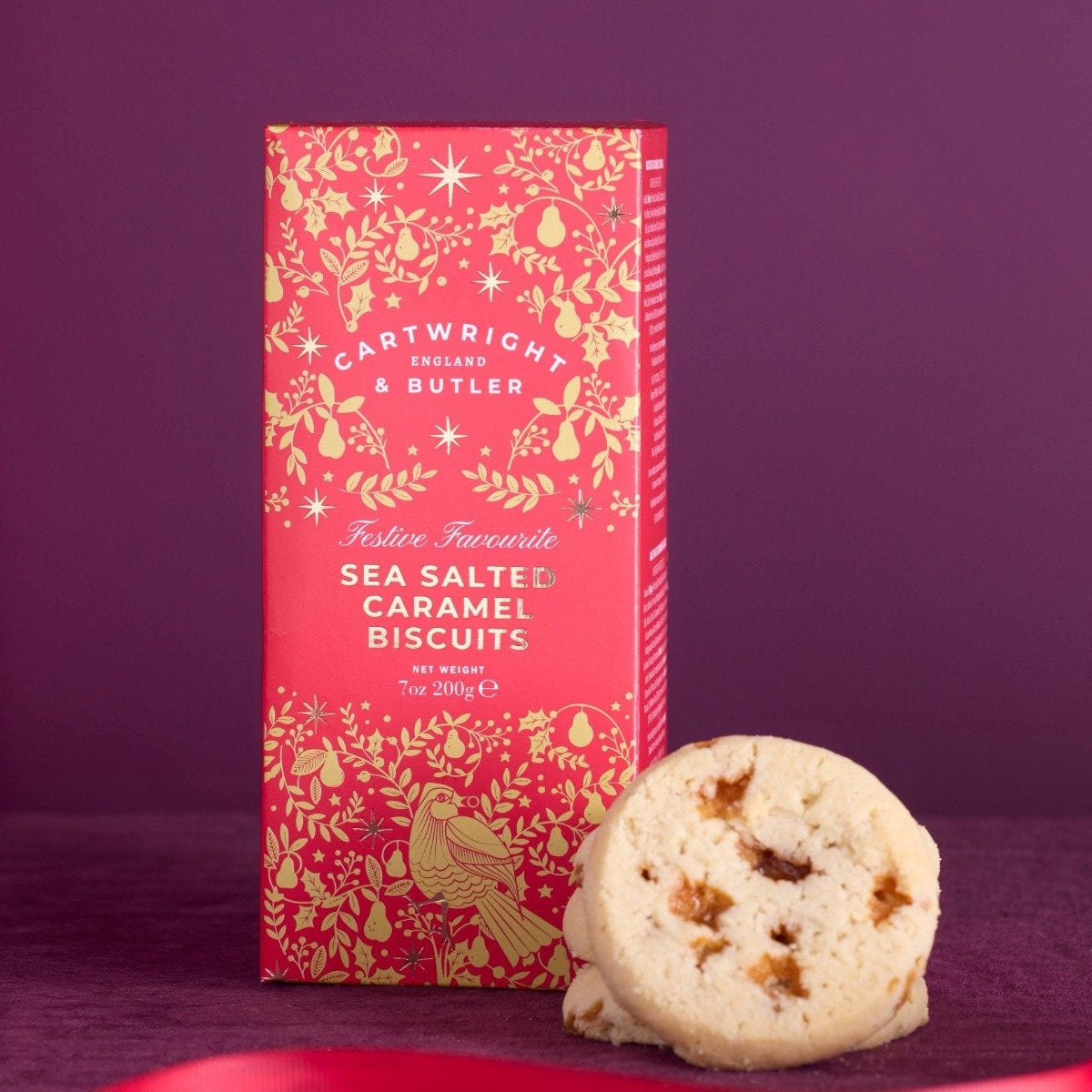 Packaging of Artwright & Butler sea salted caramel biscuits on a purple background