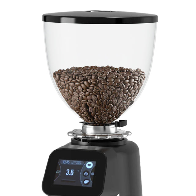 Coffee grinder with coffee beans inside on a white background