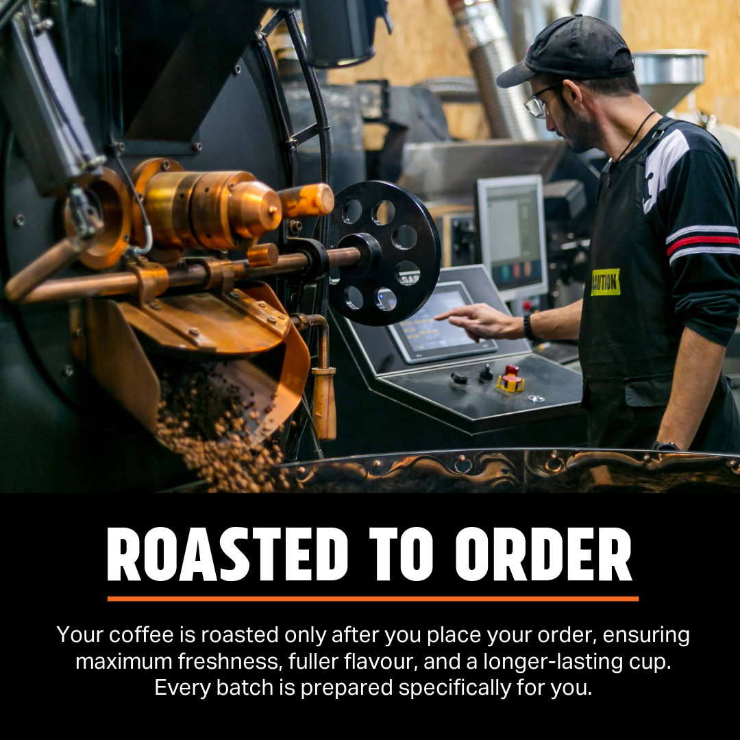 Coffee roasting machine with a person operating it, emphasizing freshness and flavor.