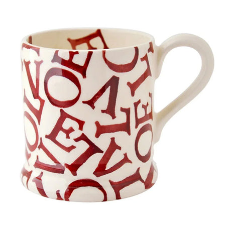 White mug with red 'LOVE' pattern on a white background