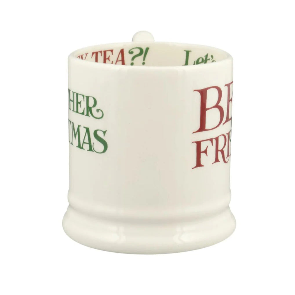 White mug with text in green and red on a white background