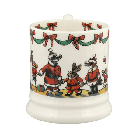 Decorative candle with festive design of animals in Santa outfits on a white background