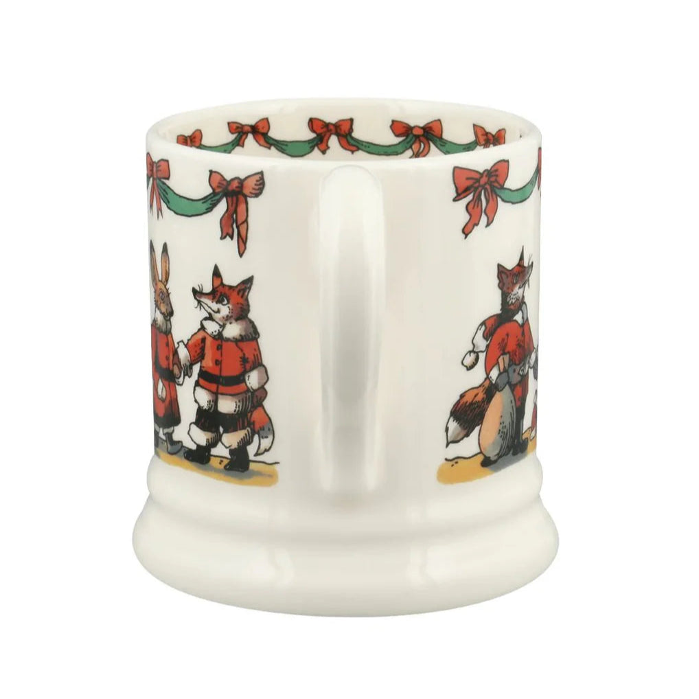 White mug with festive fox design on a white background