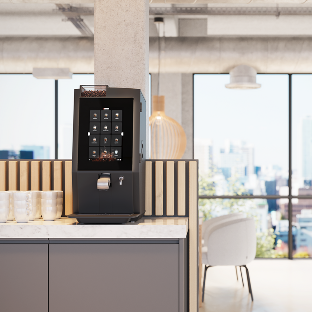 Modern office setting with a coffee machine on a counter