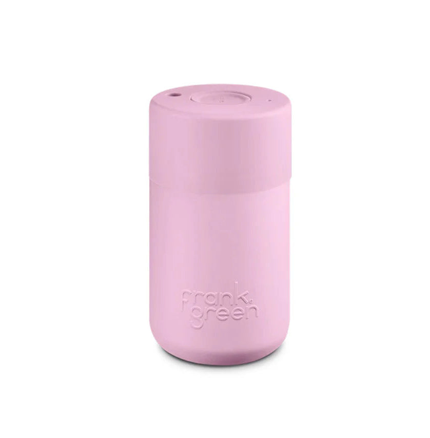 A ceramic reusable cup with a button lid, colored in lilac haze, branded with 'Frank Green'.