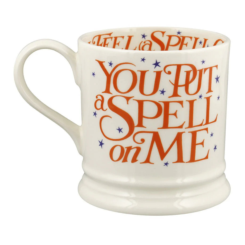 White mug with orange text 'You Put a Spell on Me' on a white background