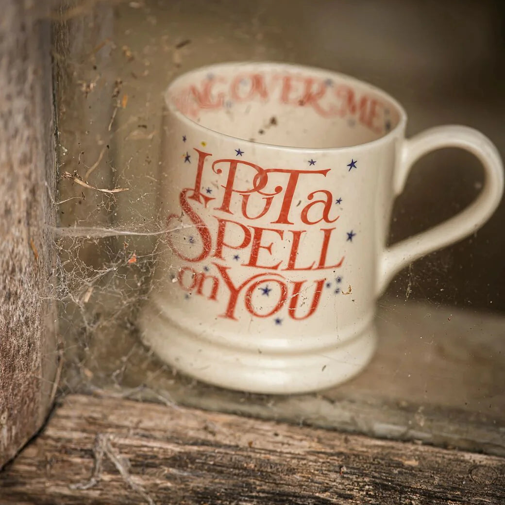 Mug with text 'I Put a Spell on You' in a rustic setting