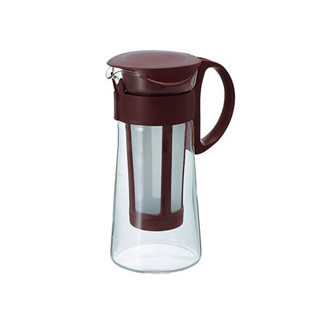 A brown Hario Mizudashi Cold Brew Coffee Maker made of glass, with a coffee filter visible inside the pot.