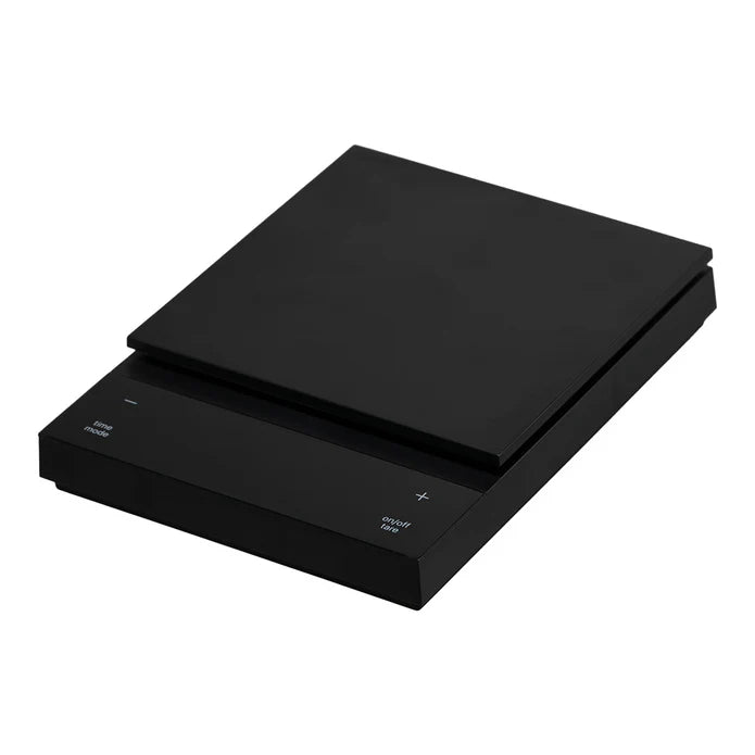 A black Hario Polaris Coffee Scale, with a flat platform on top and digital display on the front.