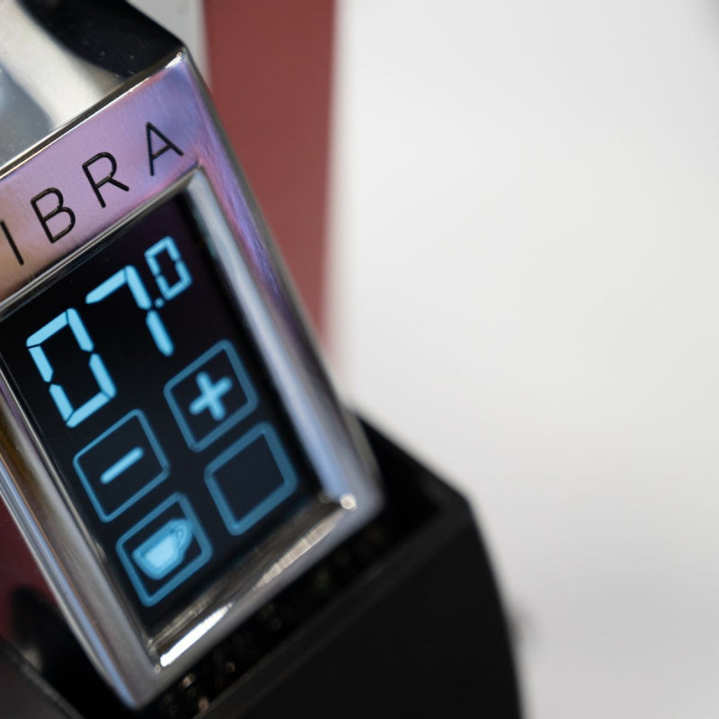 Digital display with 'IBRA' branding on a blurred background