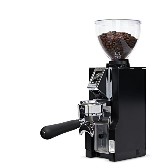 Black coffee grinder with clear container of coffee beans on a white background