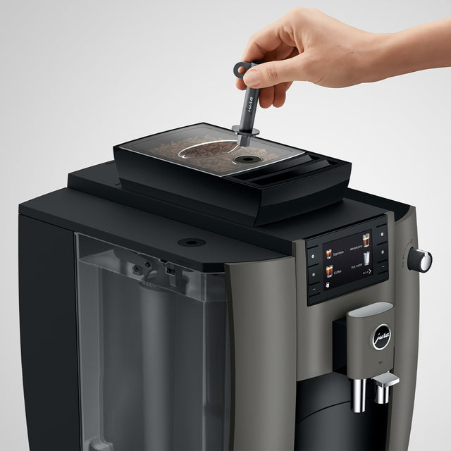 JURA W4 commercial bean-to-cup coffee machine with touchscreen display.