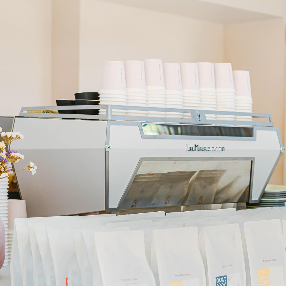 La Marzocco KB90 espresso machine with innovative straight-in portafilter and dual boiler system, ideal for high-volume coffee shops.
