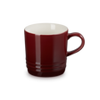 Red mug with a white interior on a white background