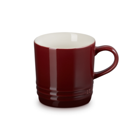 Red mug with a white interior on a white background