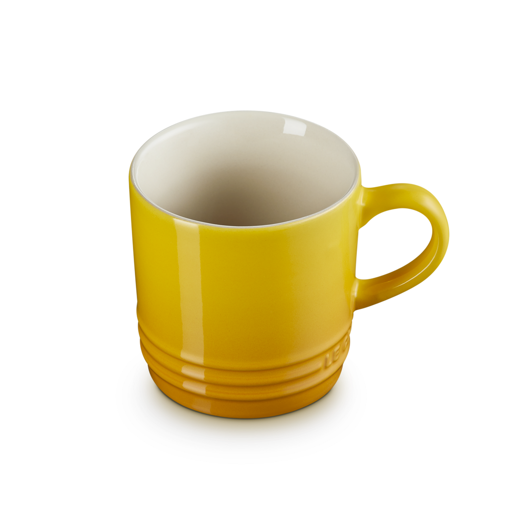 Yellow mug on a white background