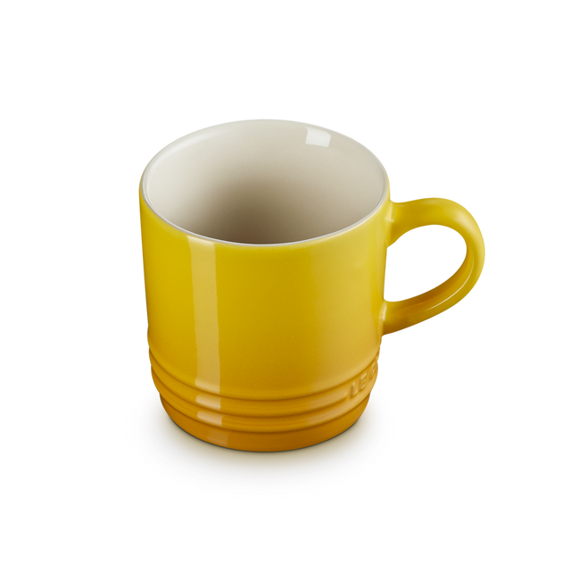 Yellow mug on a white background