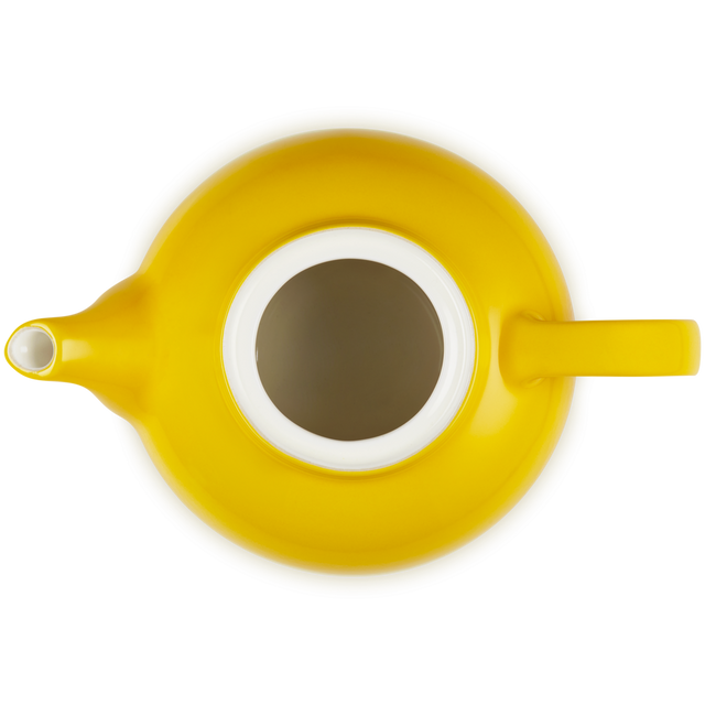 Yellow teapot with a white interior on a white background