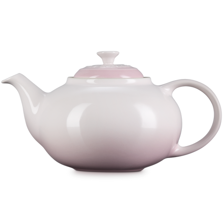 White teapot on a white background
