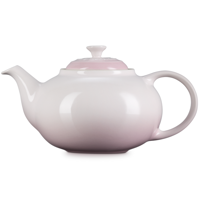 White teapot on a white background