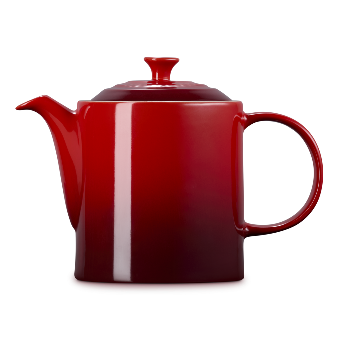 Red teapot with a white stripe on a white background