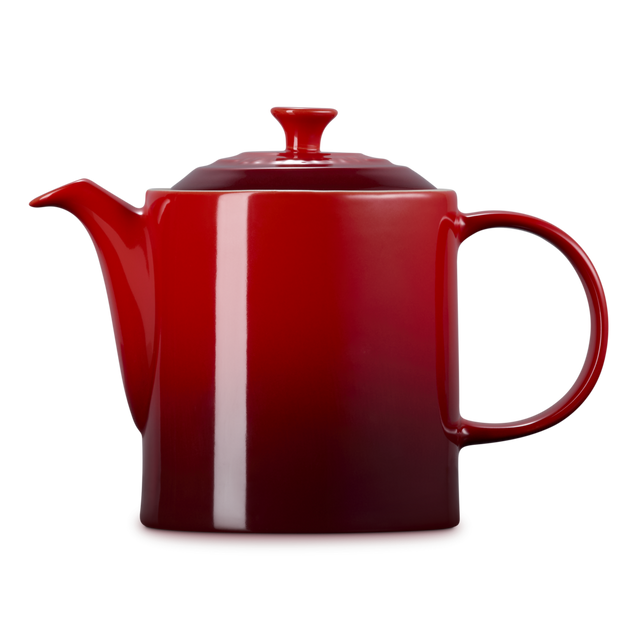 Red teapot with a white stripe on a white background