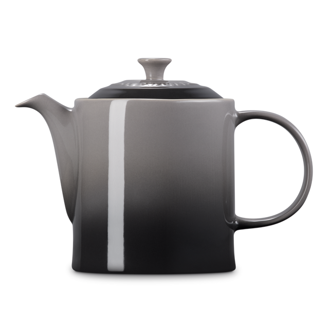Gray teapot with a white stripe on a white background