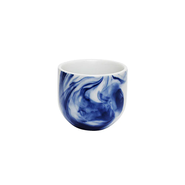 White mug with blue marbled design on a white background