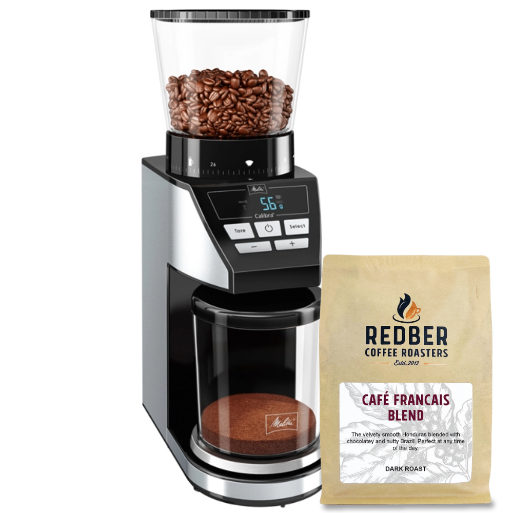 Coffee grinder with coffee beans and a bag of Redber Coffee Roasters Café Français Blend on a white background
