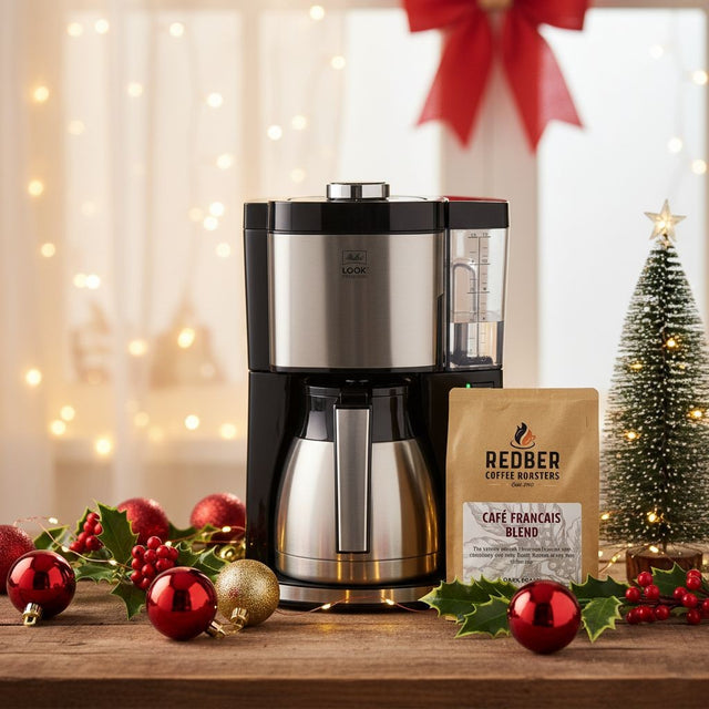 Melitta Filter Coffee maker with a bag of Redber Coffee Roasters coffee on a festive background with Christmas decorations.