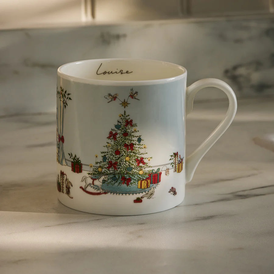 Mug with Christmas tree design on a marble surface