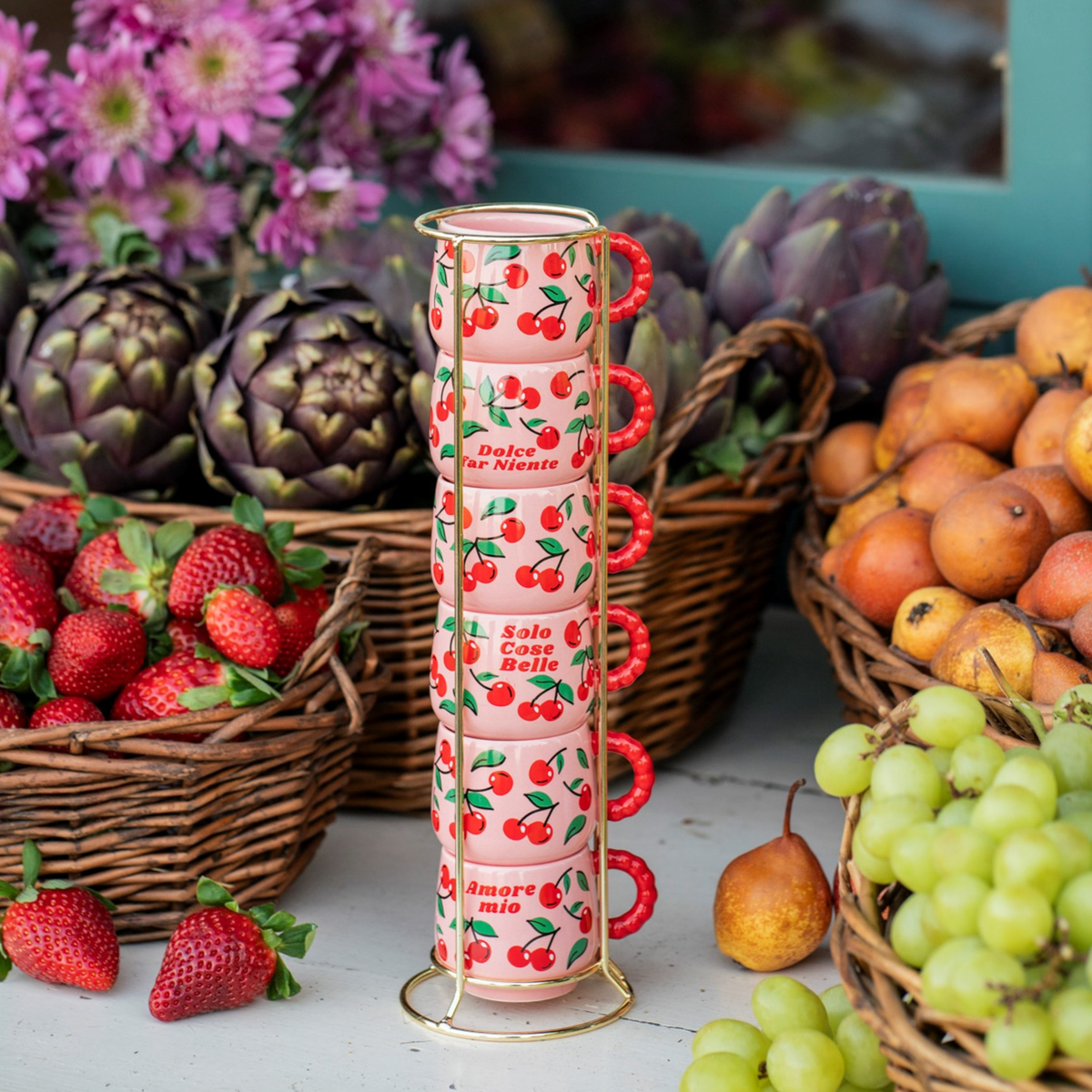 Bialetti Mercato della Frutta Cherry cup stack and stand displayed among fruit and vegetables