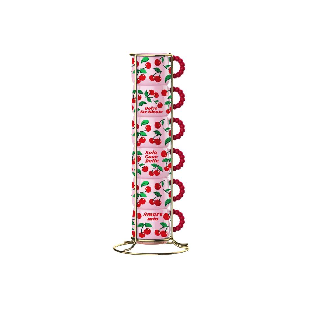 Six Bialetti Cherry espresso cups stacked in the included metal stand, with pink cherry-patterned cups and red handles