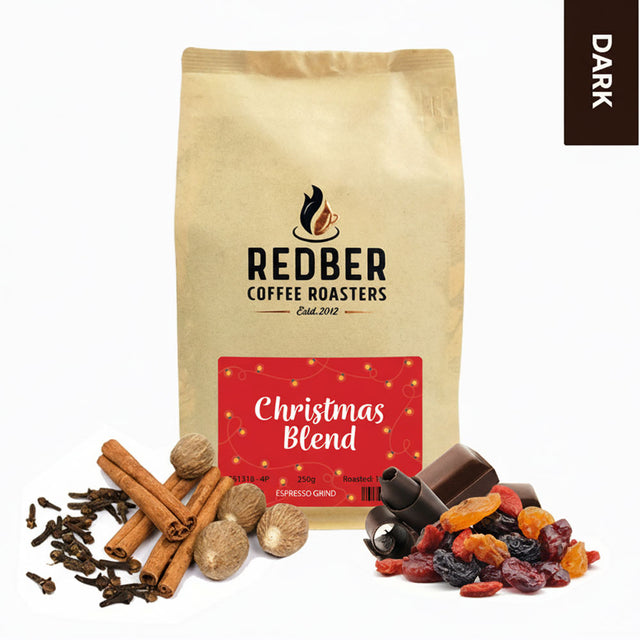 Redber Coffee Roasters Christmas Blend coffee bag with spices and dried fruits on a white background