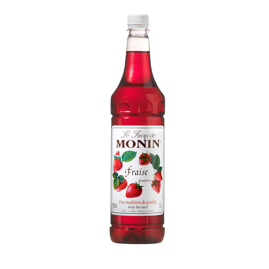 A bottle of Monin Strawberry Flavouring Syrup, 1 liter, with red liquid visible through the clear plastic packaging, labeled for beverages and desserts.