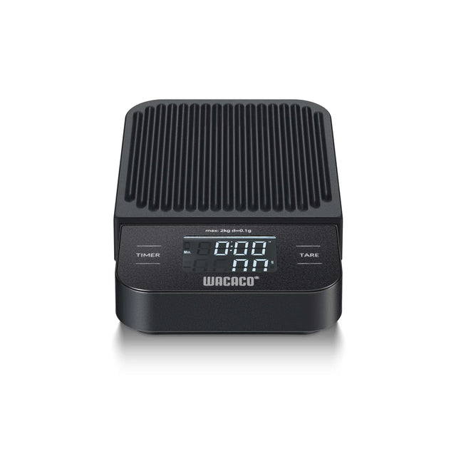Black Wacaco coffee scale with digital display on a white background