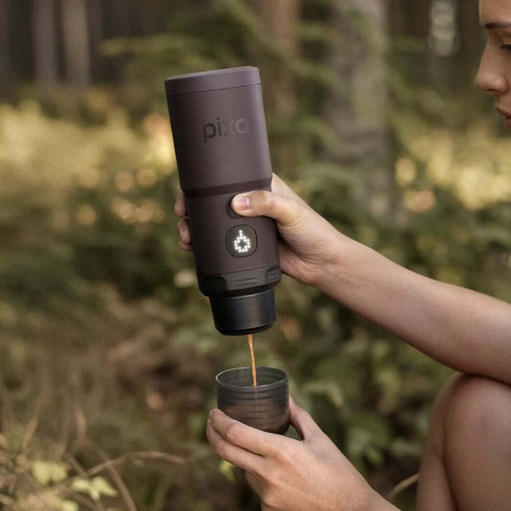 Brewing espresso outdoors with a Dark Burgundy Wacaco Pixapresso