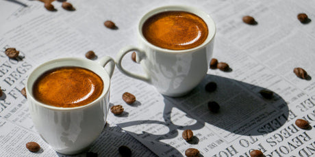 Freshly extracted espresso shot made with dark roast coffee beans