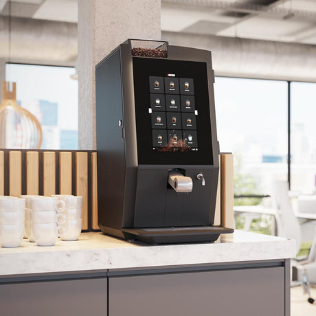 Bravilor Bonamat fully automated bean to cup coffee machine with fridge  in a office.