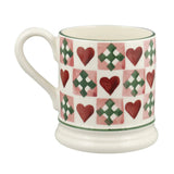 Emma Bridgewater Mug with heart and cross pattern on a white background