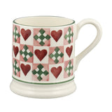 Emma Bridgewater Mug with heart and cross pattern on a white background