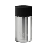 Stainless steel bottle with black cap on a pink background