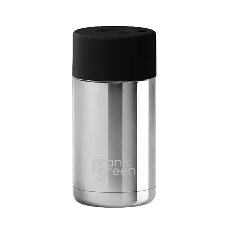 Stainless steel bottle with black cap on a pink background