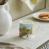 Sophie Allport Harrogate design mug on a table beside biscuits and a white jug
