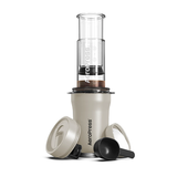Aeropress coffee maker on a white background