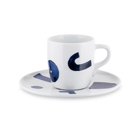 Ceramic cup and saucer with blue abstract design on a white background