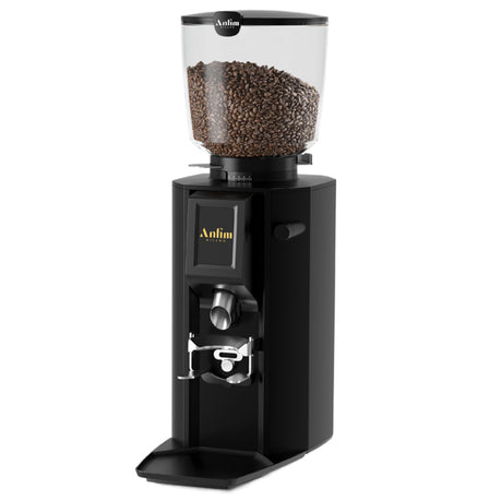 Black coffee grinder with coffee beans on a white background
