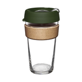 A reusable glass coffee cup with a cork band and a green press fit lid, tempered for durability.