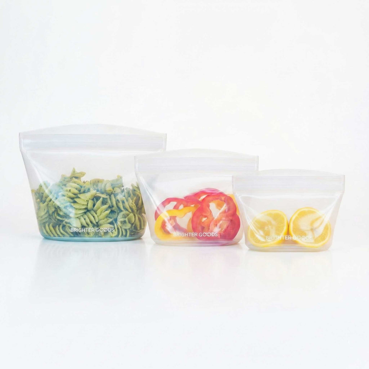 Three clear plastic containers with food items on a white background